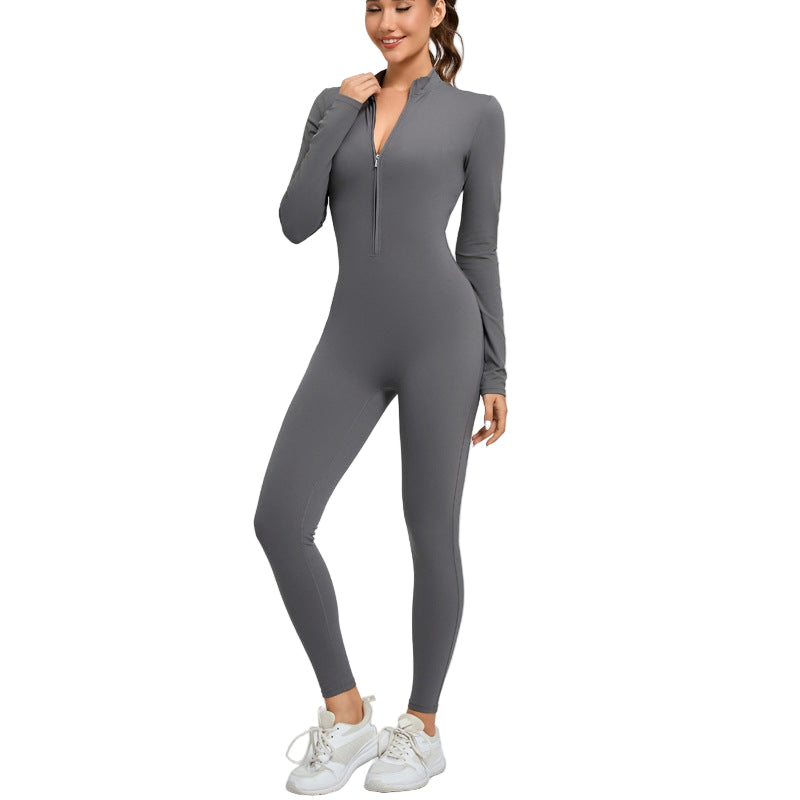 Woman wearing a gray zip-up jumpsuit on a white background