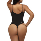 Black bodysuit worn by a model on a white background