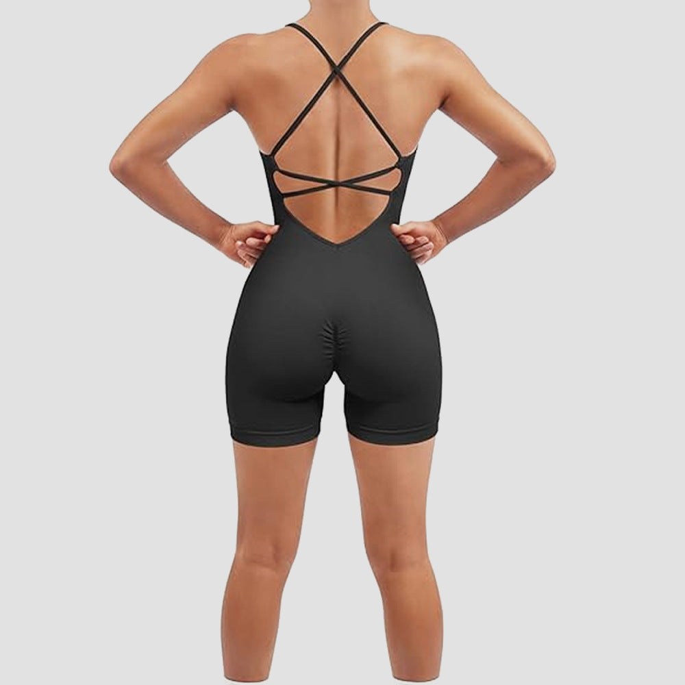Black strappy bodysuit on a plain background