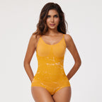 Woman wearing a yellow bodysuit against a white background