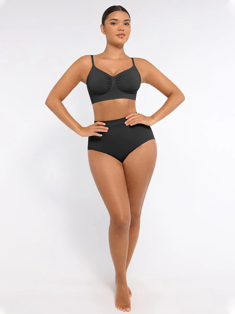 Woman wearing a black bikini set on a white background