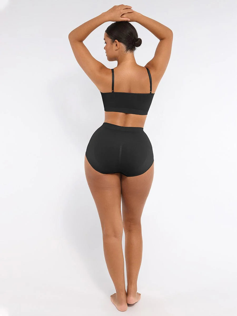 Person wearing a black bikini set on a white background
