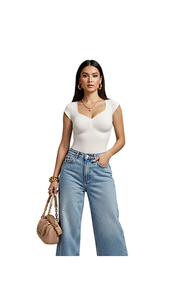 Woman wearing a white top and blue jeans, holding a beige handbag on a white background