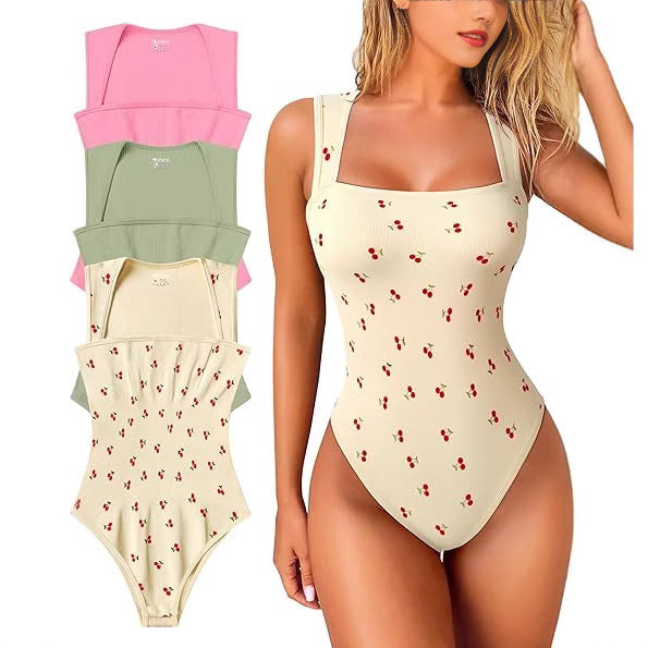 Woman wearing a beige swimsuit with cherry pattern, with additional swimsuits displayed on the left.