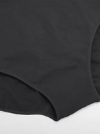 Close-up of a black fabric texture on a white background