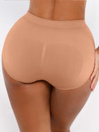 Beige shapewear worn by a person on a white background
