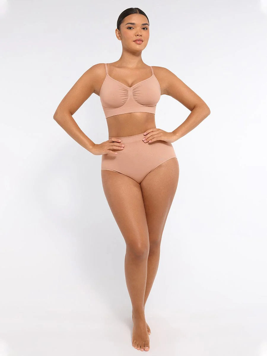Woman wearing a beige bikini set on a white background