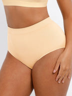 Beige high-waisted bikini bottom on a neutral background