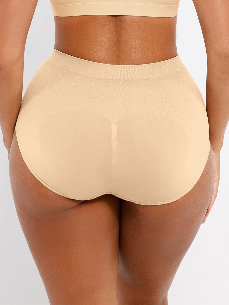 Beige high-waisted underwear on a plain background