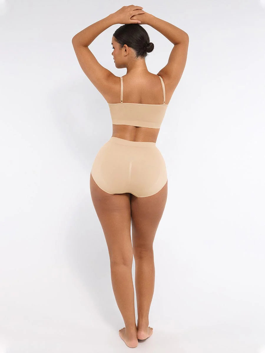 Woman wearing a beige swimsuit on a white background