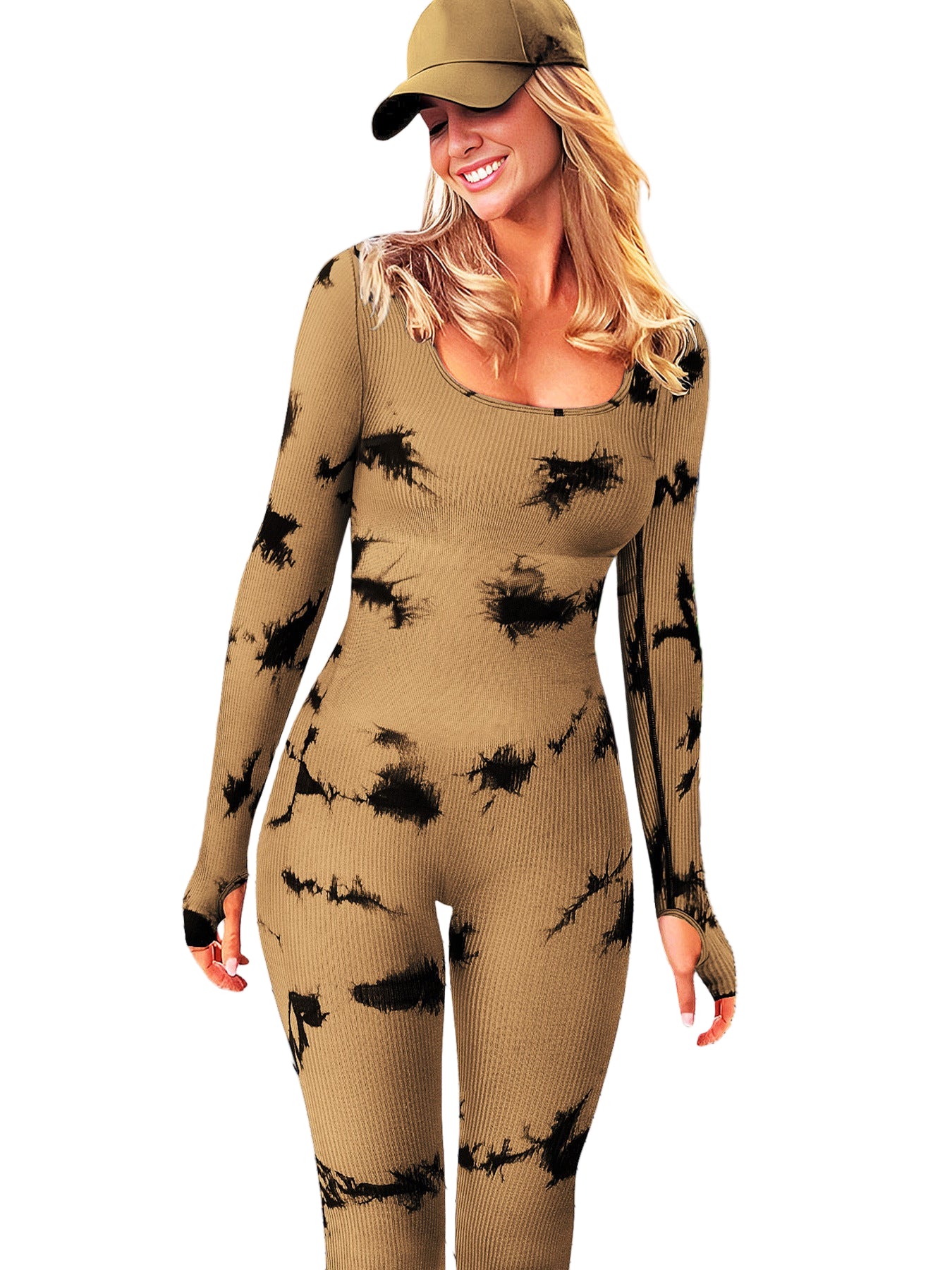 Woman wearing a beige and black patterned outfit on a wooden deck with plants and buildings in the background.