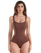 Woman wearing a brown bodysuit with cut-out design on a white background