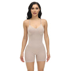 Woman wearing a beige shapewear bodysuit on a white background