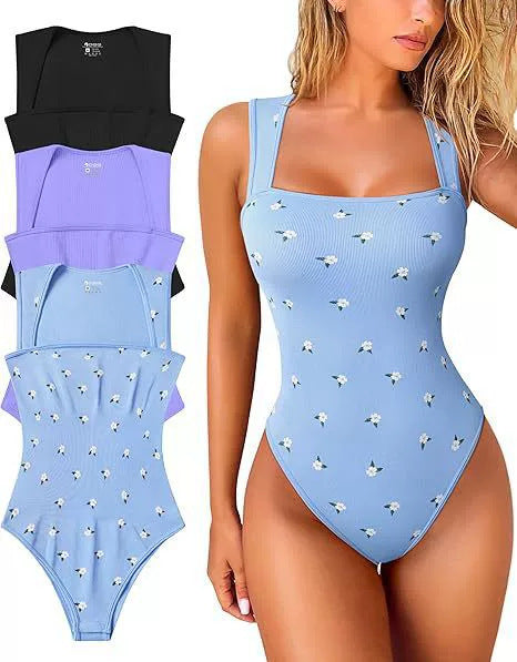 Woman wearing a blue one-piece bodysuit with floral pattern, with additional swimsuits displayed on the left.