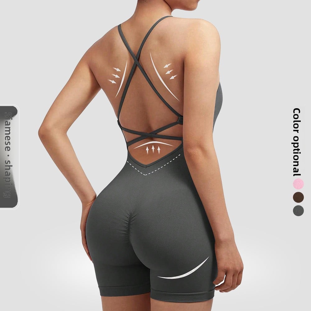 Person wearing a gray bodysuit with open back design on a white background