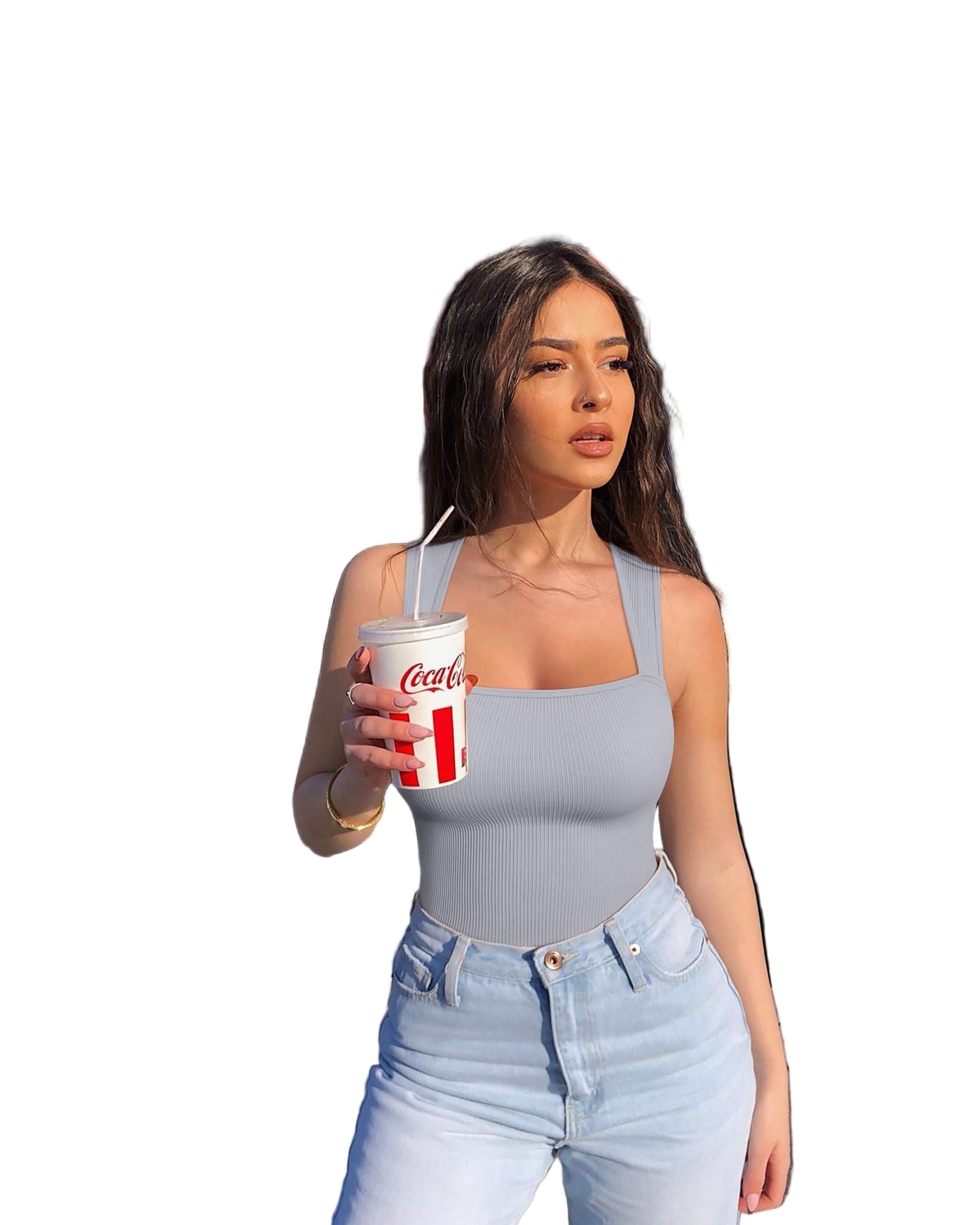 Woman holding a Coca-Cola cup in front of a fast-food restaurant with red signage.