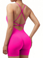 Pink strappy jumpsuit on a white background