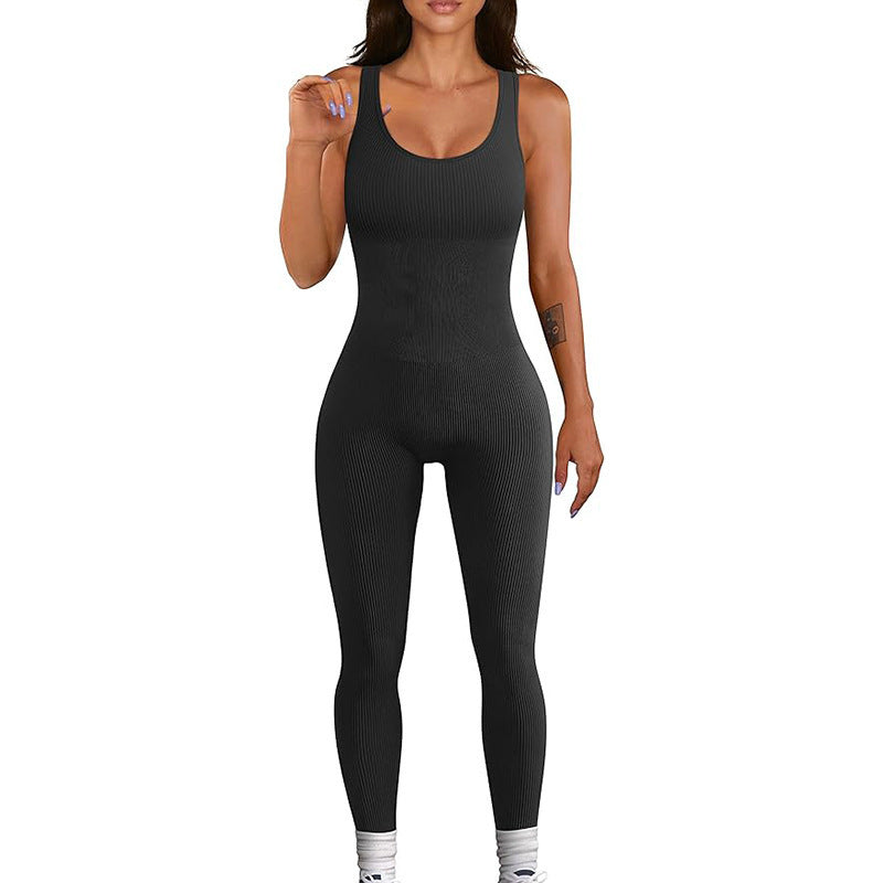 Black ribbed jumpsuit worn by a model on a white background
