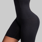Black waist trainer with text highlighting features on a beige background
