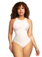 Woman wearing a white bodysuit with 'Global Recycled Standard' logo in the corner.