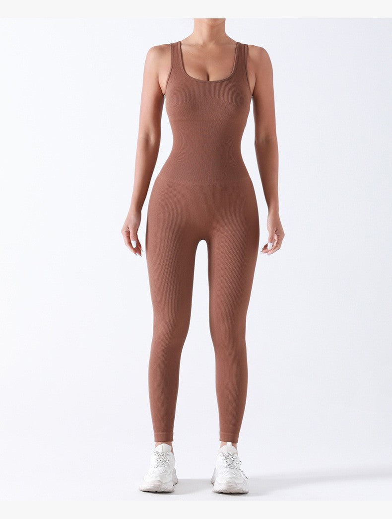 Person wearing a brown bodysuit on a white background