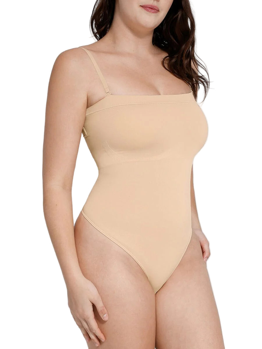 Beige swimsuit worn by a model on a plain background