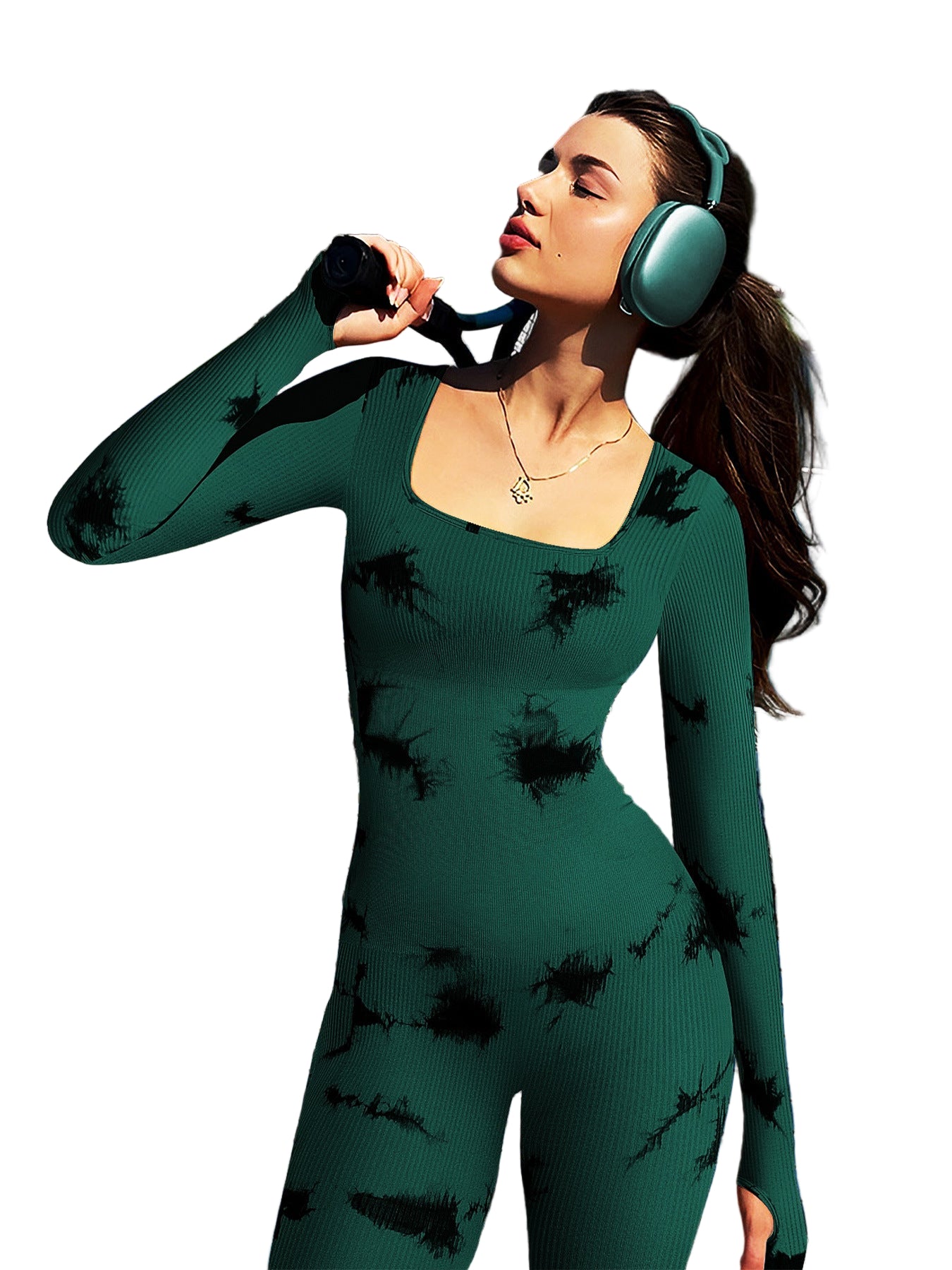 Woman in a green dress with black patterns on a tennis court