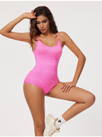 Woman wearing a pink bodysuit on a white background