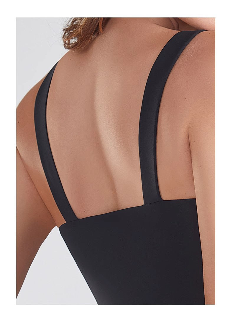 Black bodysuit with thin straps on a white background