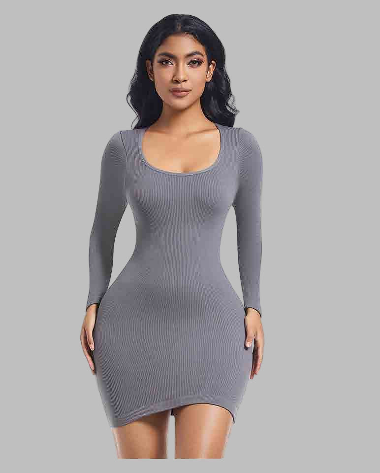 Woman wearing a gray long-sleeve dress on a white background