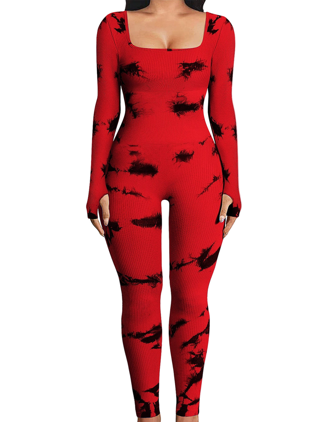 Red jumpsuit with black abstract patterns worn by a person indoors.