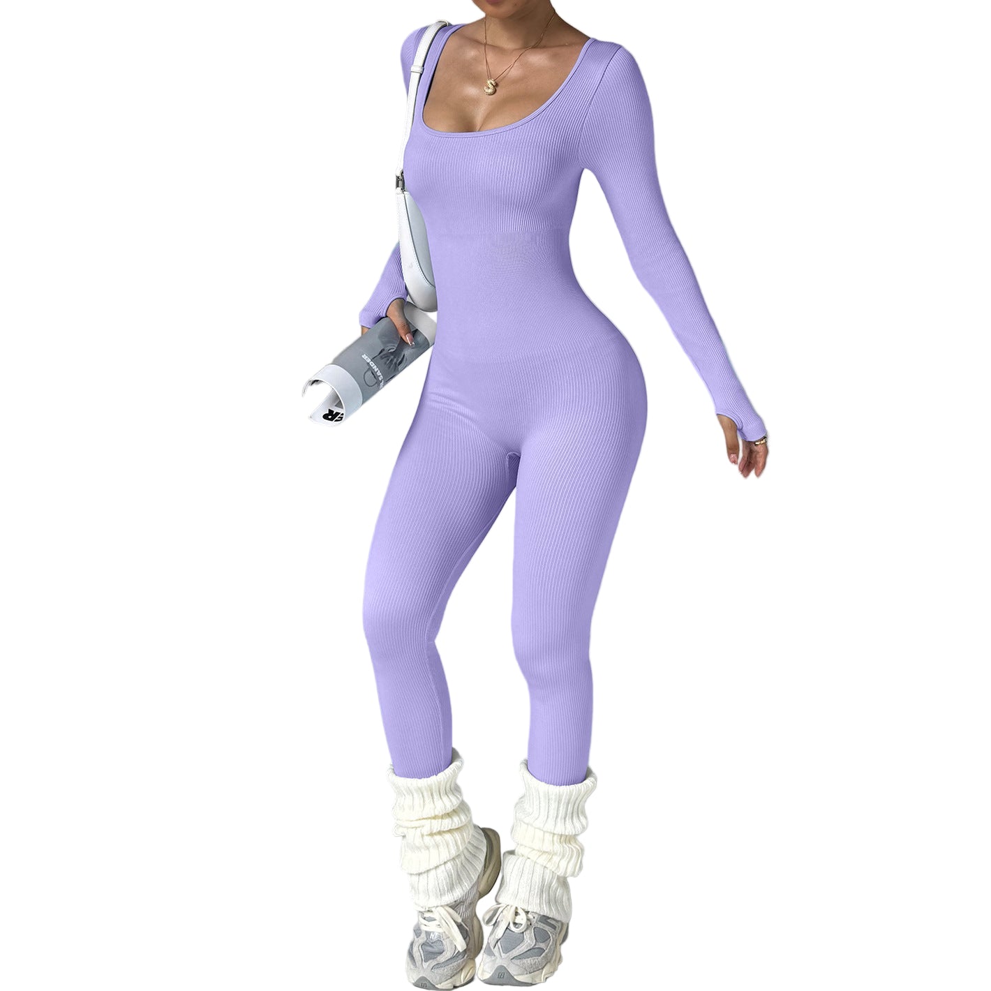 Person wearing a purple jumpsuit with white socks and shoes on a gray background