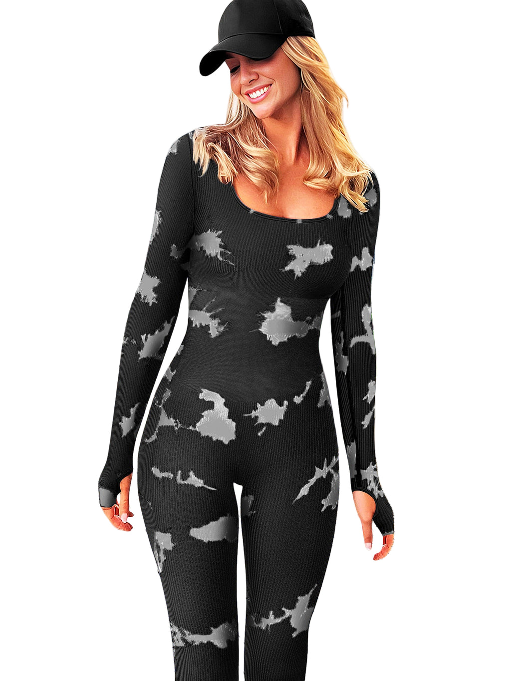 Woman wearing a black knit outfit with gray patterns on a wooden deck.