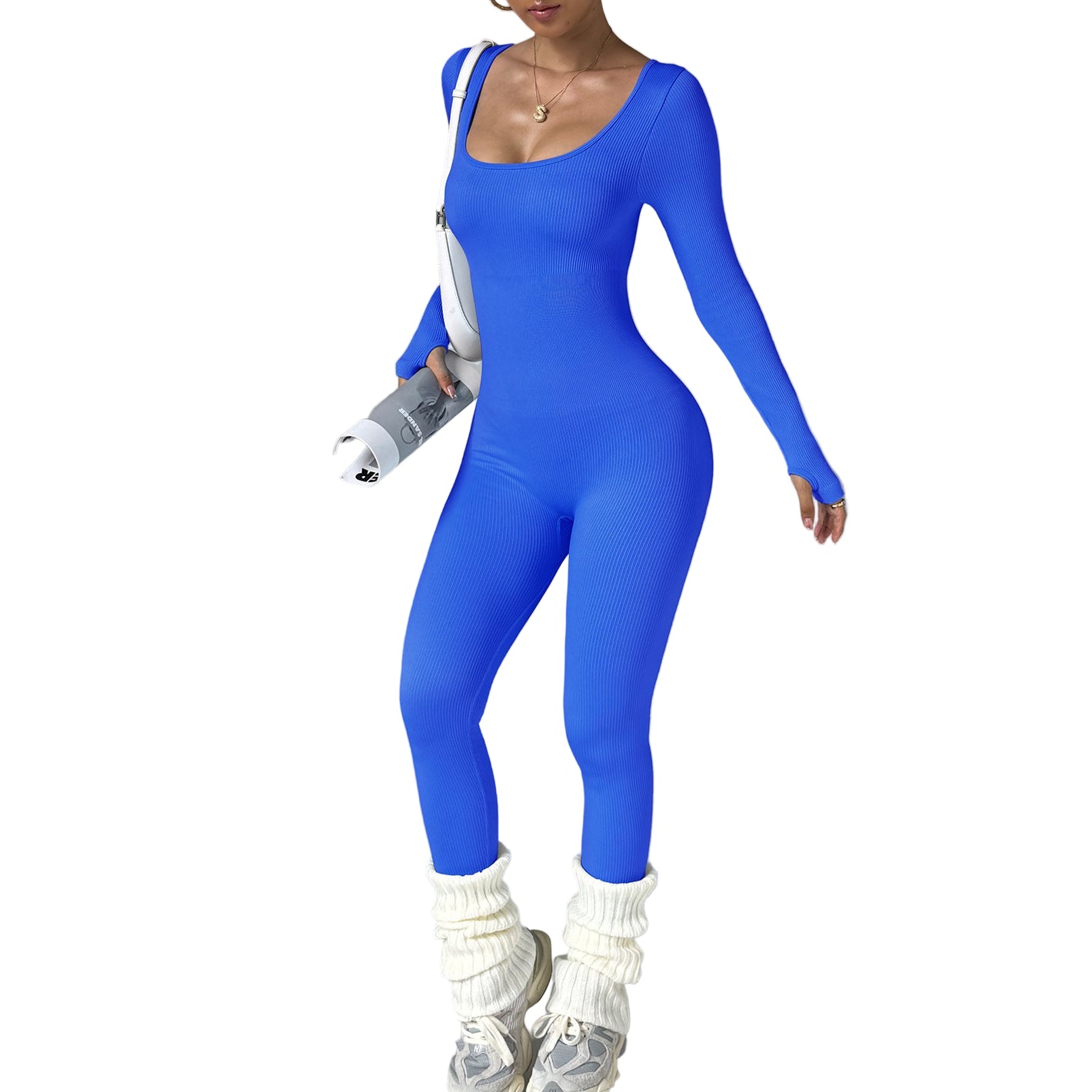 Person wearing a blue jumpsuit with white boots on a gray background