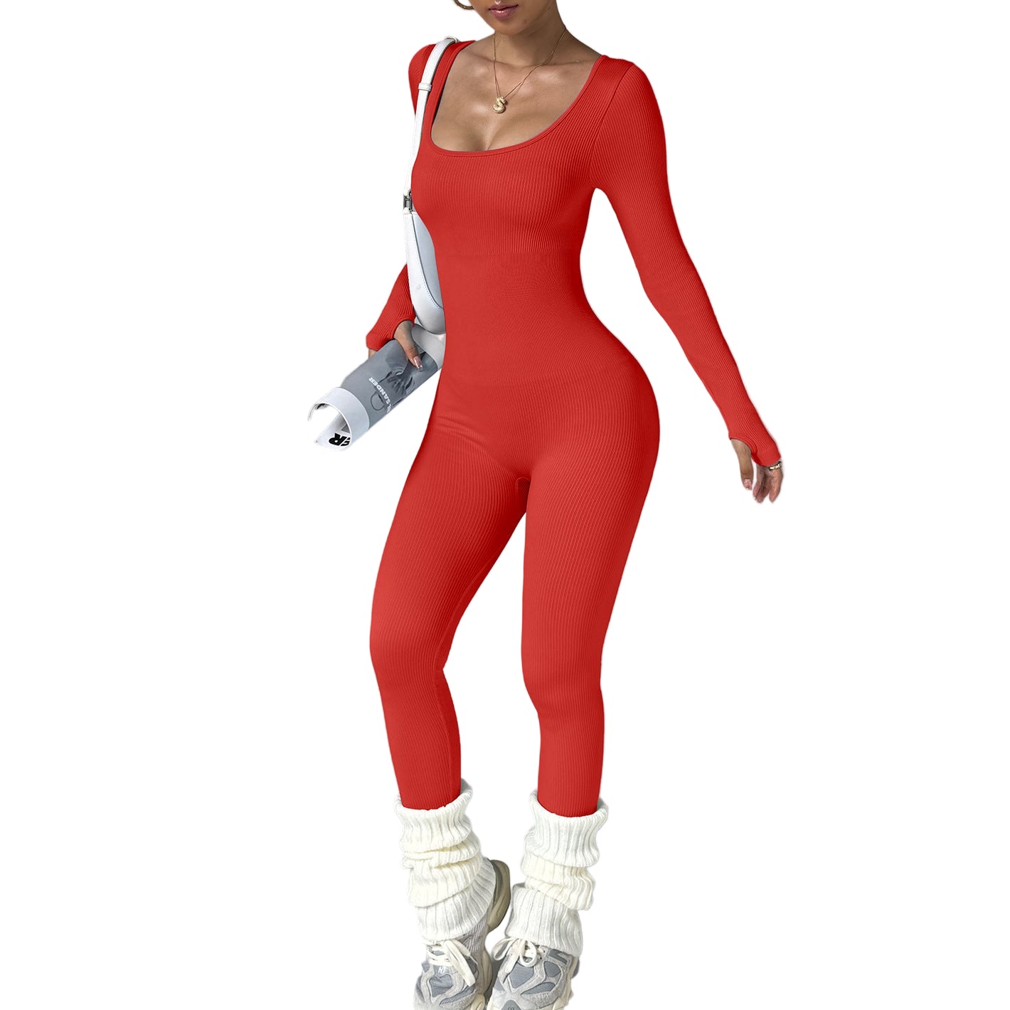 Person wearing a red jumpsuit with white accessories on a gray background