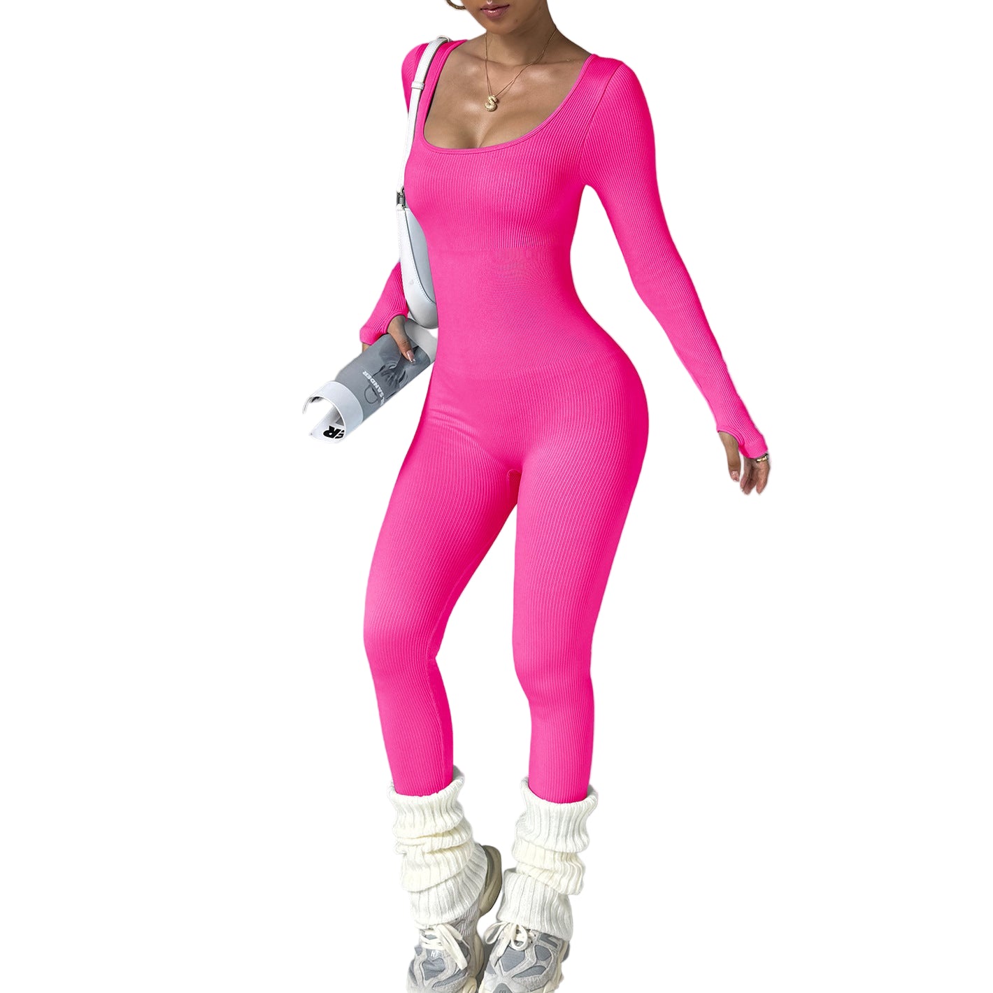 Person wearing a bright pink bodysuit with white boots on a gray background