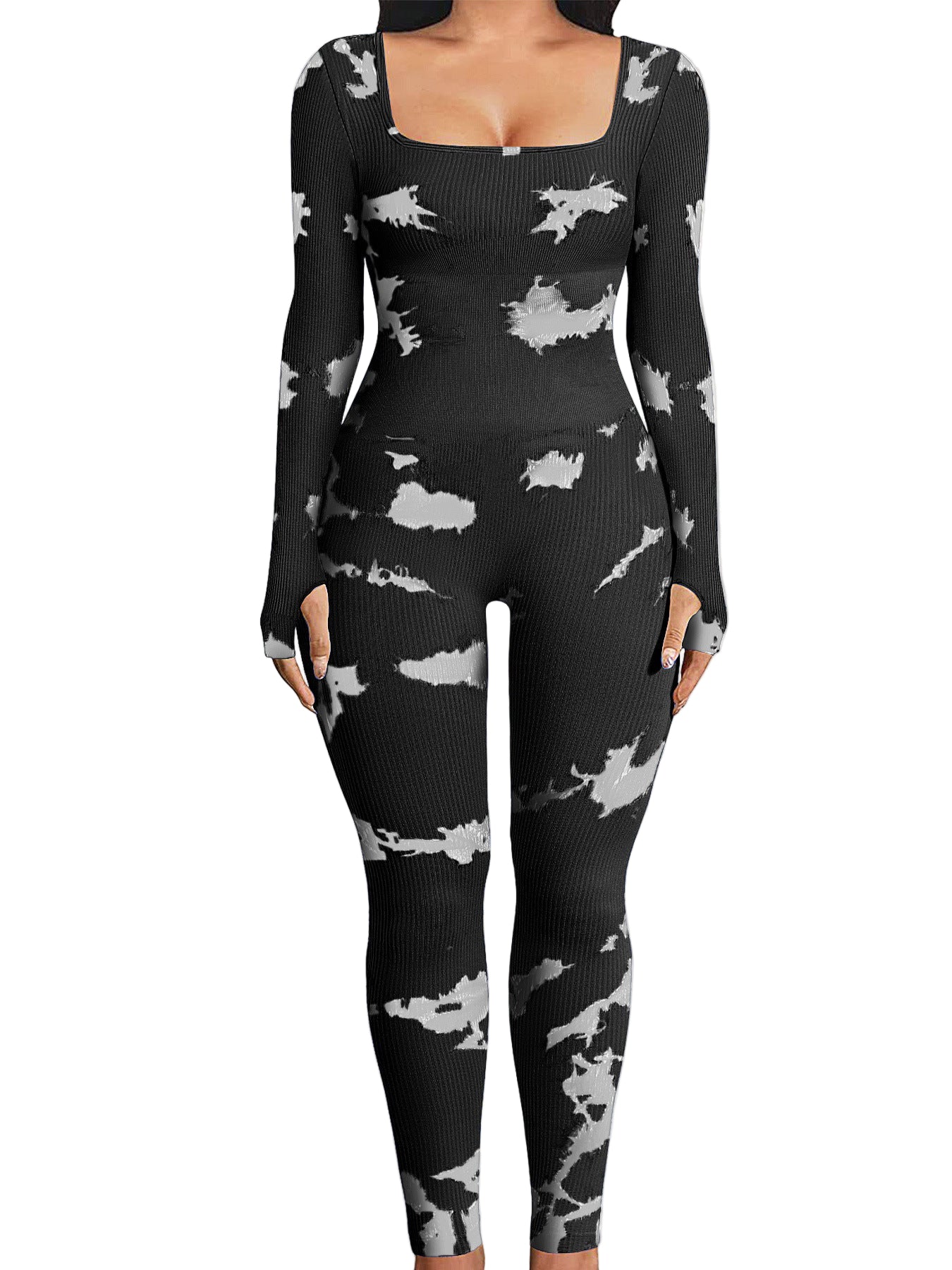 Black patterned jumpsuit worn by a person indoors with a neutral background