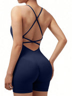 Navy blue bodysuit with criss-cross straps on a white background