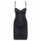 Black slip dress with thin straps on a white background