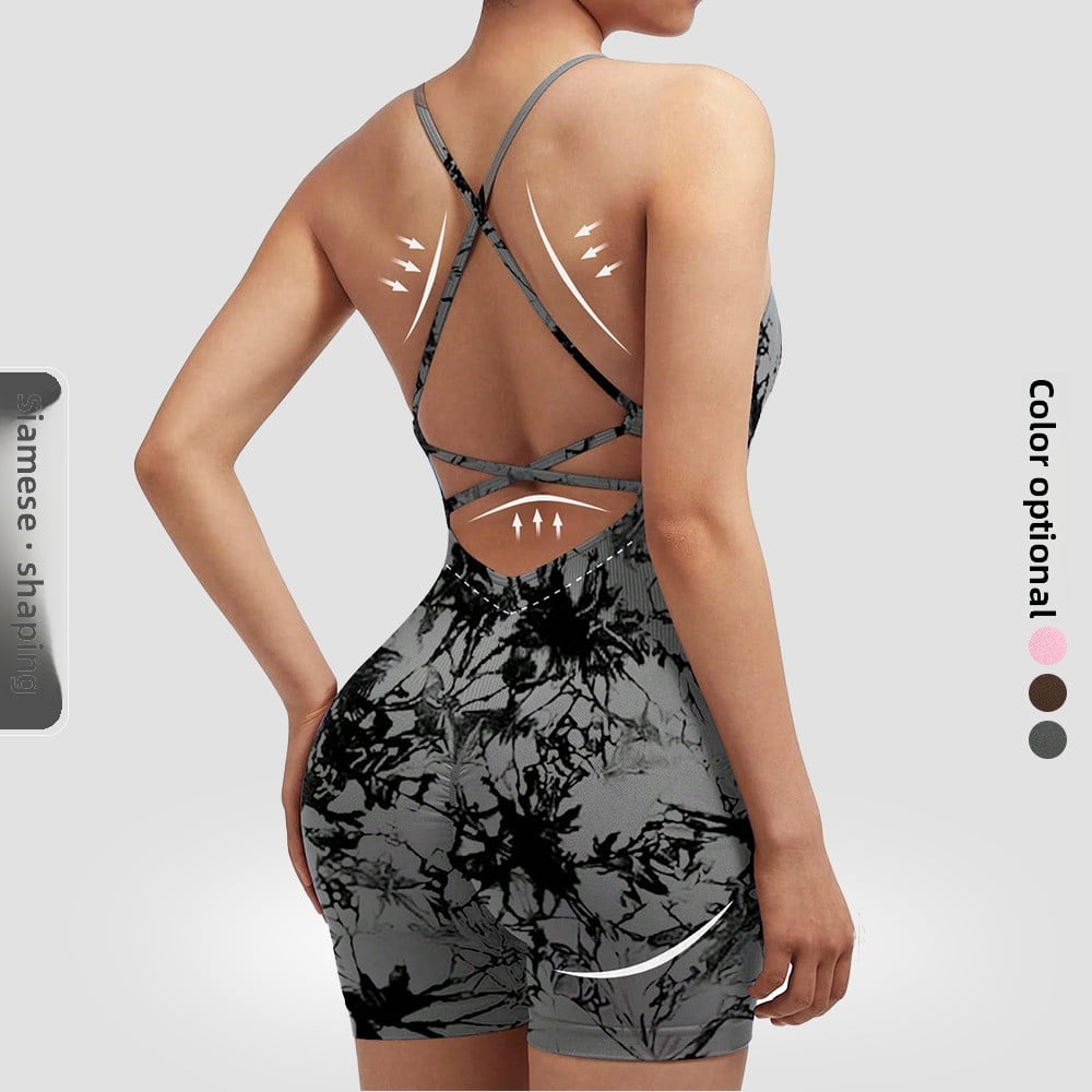 Gray and black patterned romper on a plain background