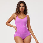 Woman wearing a purple bodysuit with a white background