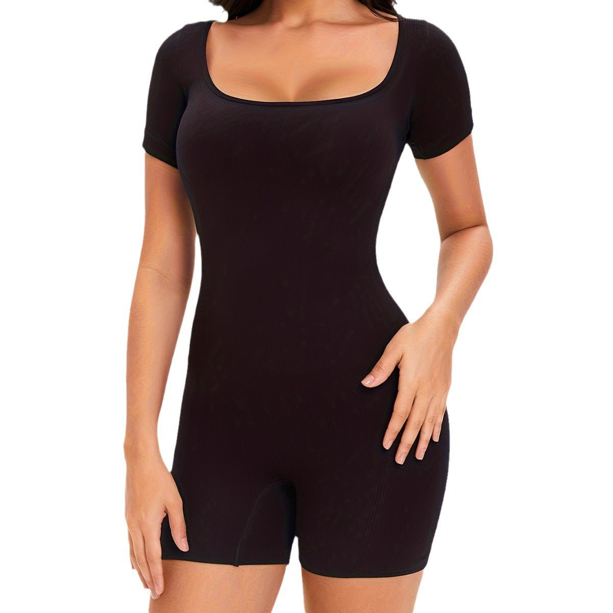 Black shapewear bodysuit worn by a model on a white background