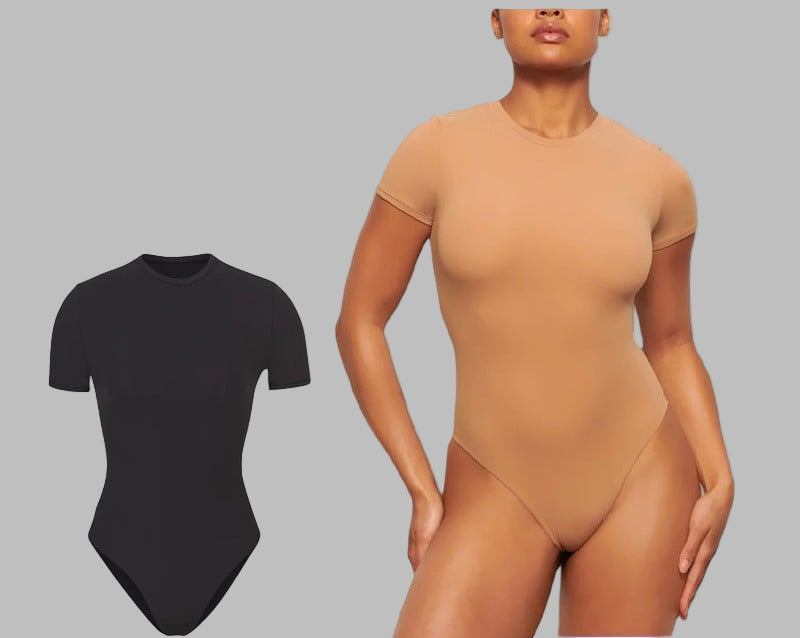 Woman wearing a beige bodysuit on a blue background