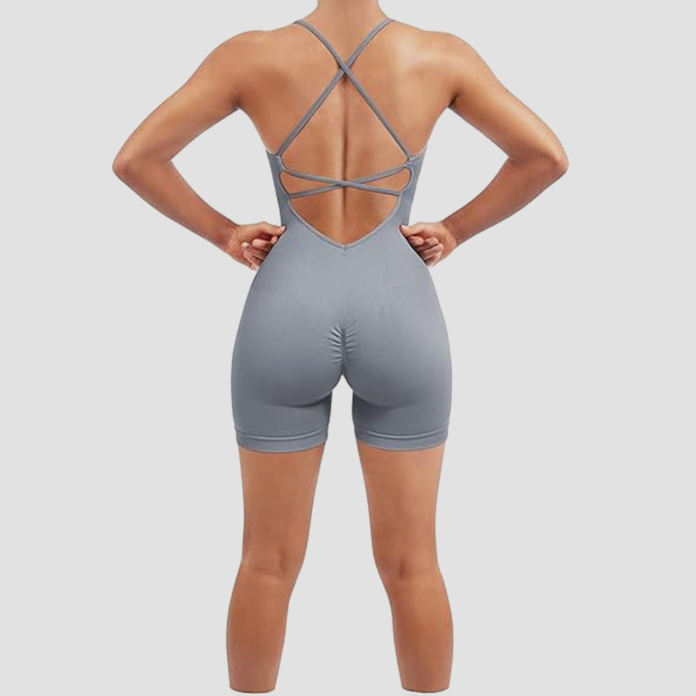 Gray romper with criss-cross back design on a plain background