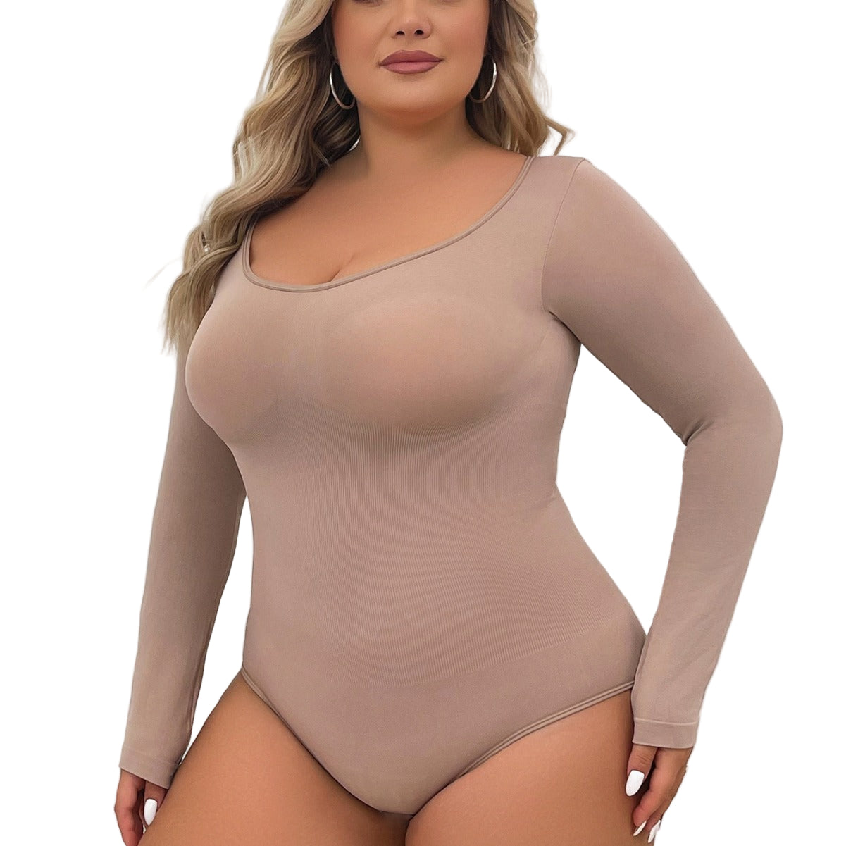 Woman wearing a beige long-sleeve bodysuit against a white background