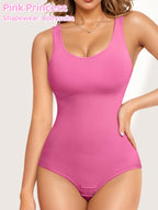 Pink shapewear bodysuit worn by a model on a light pink background