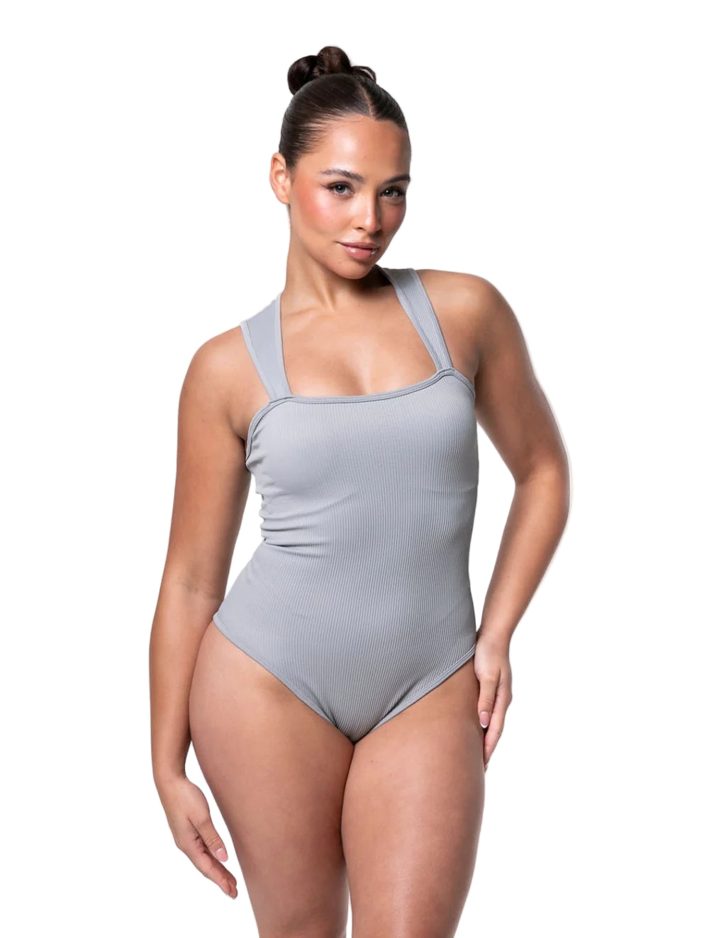 Woman wearing a gray swimsuit on a white background