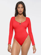 Red swimsuit worn by a model on a white background