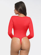Red bodysuit worn by a person on a white background