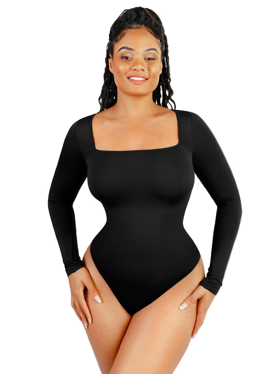 Woman wearing a black long-sleeve bodysuit on a white background